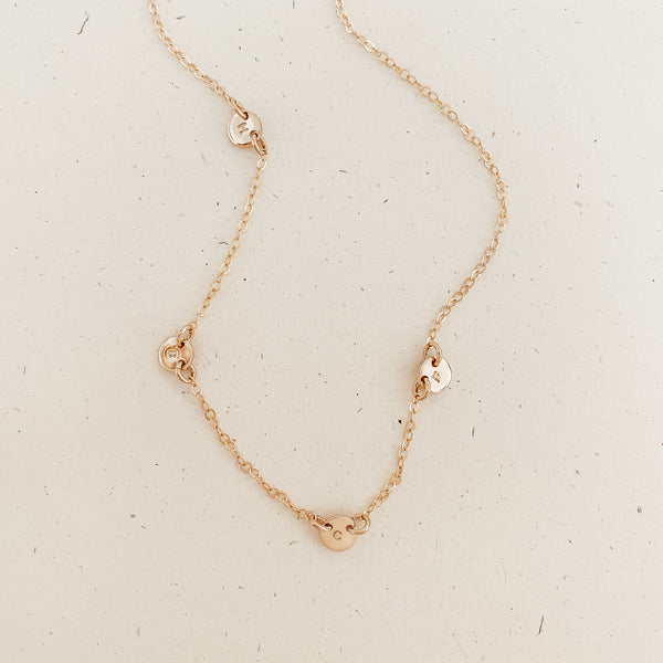 tiny pendant necklace dainty delicate sterling silver rose goldfill multiple pendant tiny initial tiny symbol asymmetrical pendant necklace uneven spacing